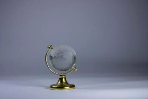 Crystal globe on a table Stock Photos