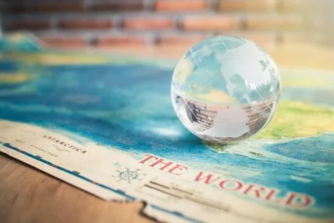 Crystal globe on world map Stock Photos