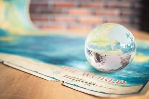 Crystal globe on world map Stock Photos