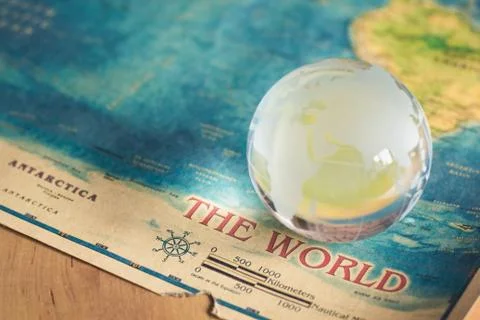 Crystal globe on world map Stock Photos