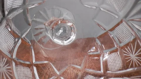 Crystal goblets are randomly placed on their sides on a wooden table. Stock Footage 211399030