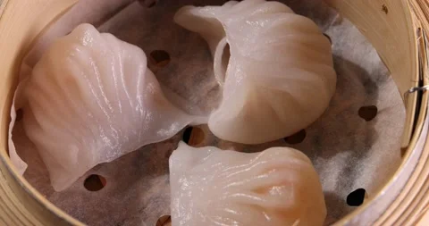 Crystal har gow transparent prawn shrimp chicken meat stuffed dim sum in bamboo  Stock Footage 217326316
