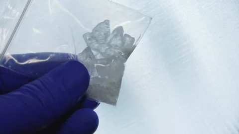 Crystal meth is strong form of amphetamine. Comes as powder crystals or tab.. Stock Footage 341143649