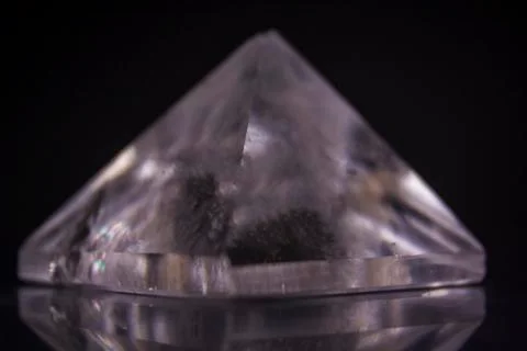 Crystal Pyramid on black background Stock Photos