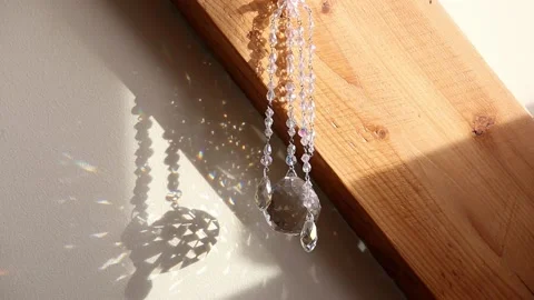 Crystal rainbow maker suncatcher hanging in home. 스톡 동영상 148209311