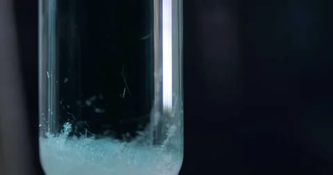 Crystal Regrowth Process in Oblong Glass Test Tube Close Up, Chemical Substance Stock Footage 322603057