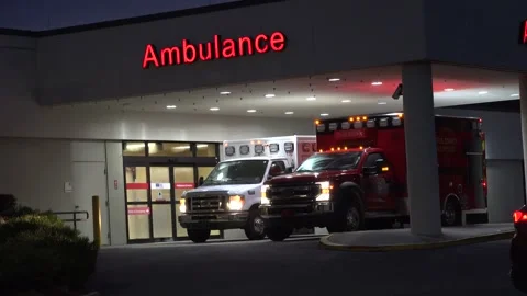 Crystal River,  Florida - September 29, 2024: Ambulances at the ER entrance Stock Footage 286050247