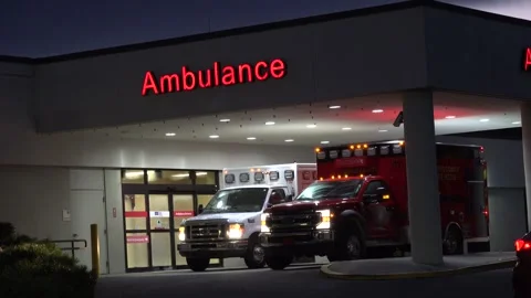 Crystal River,  Florida - September 29, 2024: Ambulances at the ER entrance Stock Footage 286050302