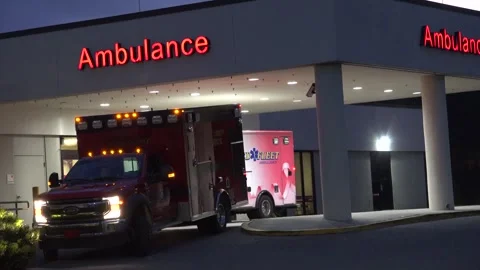 Crystal River,  Florida - September 29, 2024: Ambulances at the ER entrance Stock Footage 286050332