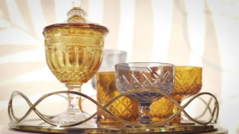 Crystal set for wine. Cups and wine glasses spinning on a beautiful tray. Stock Footage 155080150