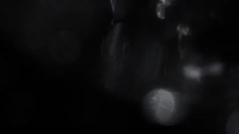 Crystal silver bokeh light overflowing on a black background Stock-Footage 318364883