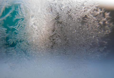 Crystal snowflakes on glass close-up, macro, background, texture, copy space Stock Photos