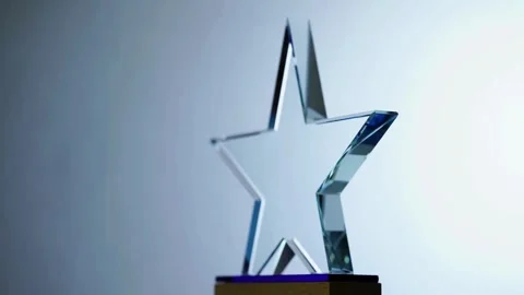 Crystal star award trophy rotating against a light background Stock-Footage 333809390