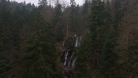 Crystal stream tumbling over rocks in forest near Tendon France Stock Footage 306795953