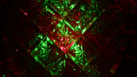 The crystal surface passes through itself rays of green and red light. 動画素材 305020940