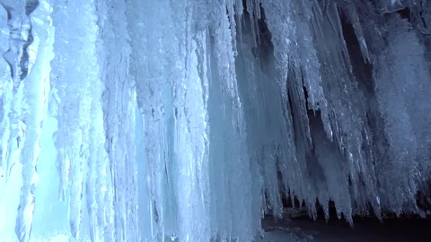 Crystal transparent shiny ice, many sharp icicles frozen Lake Baikal winter 4k   Stock Footage 317963469