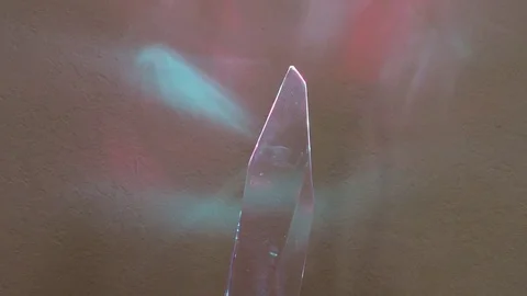 Crystal turning clockwise showing red &amp; blue reflections Stock Footage 84338959