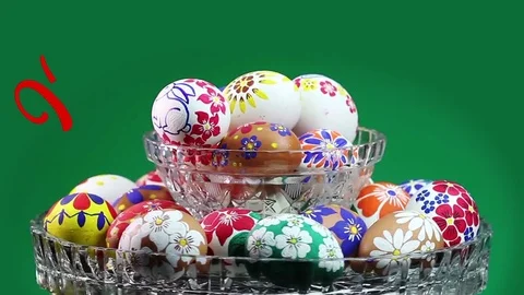 A crystal vase with Easter eggs. Appears the text "Happy Easter" Stock Footage 74405222