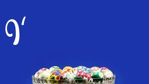 A crystal vase with Easter eggs revolves and appears the text "Happy Easter" Stock Footage 74408154