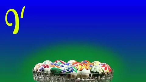 A crystal vase with Easter eggs revolves and appears the text "Happy Easter" Stock Footage 74408163