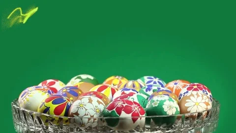 A crystal vase with Easter eggs revolves and appears the text "Happy Easter" Stock Footage 74408174