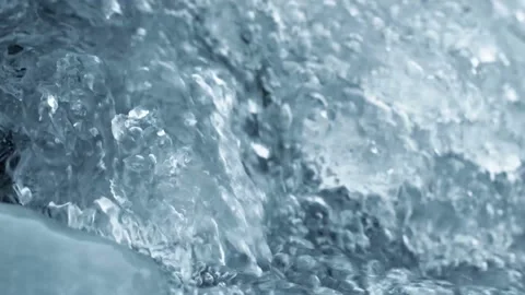 Crystal water with air bubbles and ice. Close up slow motion nature background f Stock Footage