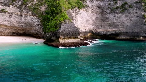 Crystal Waters and Towering Cliffs at Kelingking Beach, Bali Stock Footage 238416065