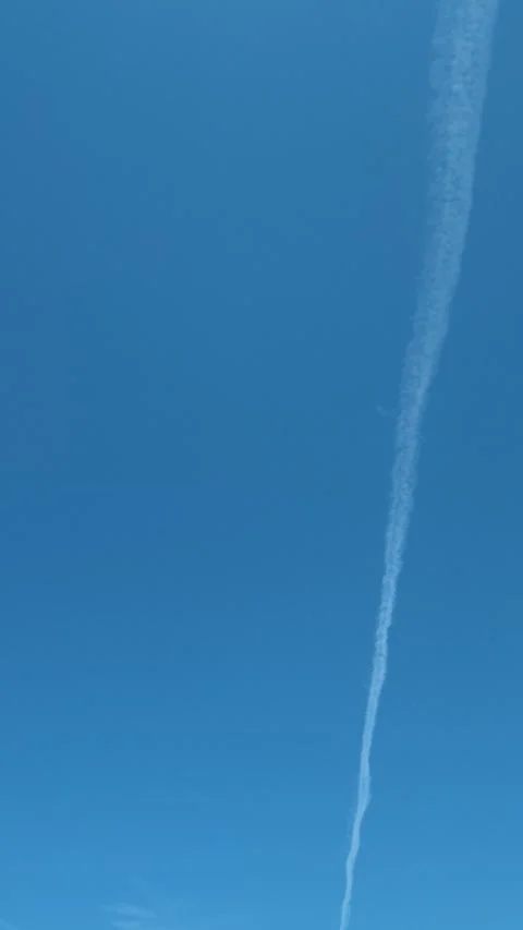 Crystal waters ripple under a vast, cloudless sky. Lagomandra, Greece. Vertical Vídeo Stock 339627055