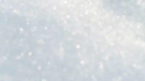 Crystal-white background. White snowflakes in a defocused form. Video stock 304944503