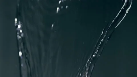 Crystalline Fluids Rapidly Pour Down With Splashing Microbubbles In A Stock Footage 140250489