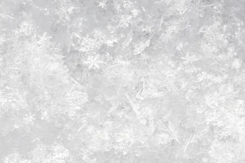 Crystalline ice patterns form a textured, frosty surface Stock Photos