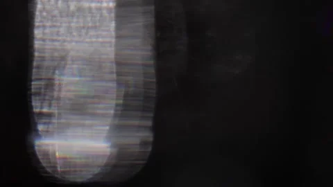 Crystalline vertical light shining left in the darkness 動画素材 319390581