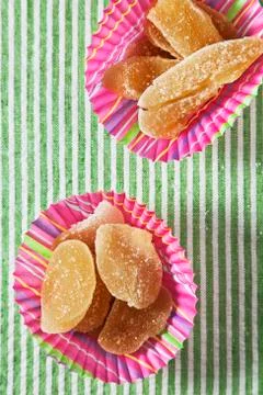 Crystallized Ginger in Colorful Cupcake Wrappers Stock Photos