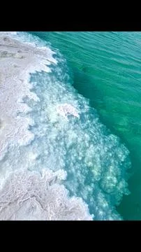 Crystallized salt formation blends into clear water, creating a dynamic Stock Photos