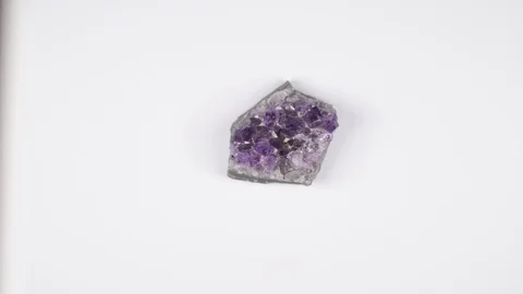 Crystals of amethyst on rock isolated on white background Stock Footage 123305451