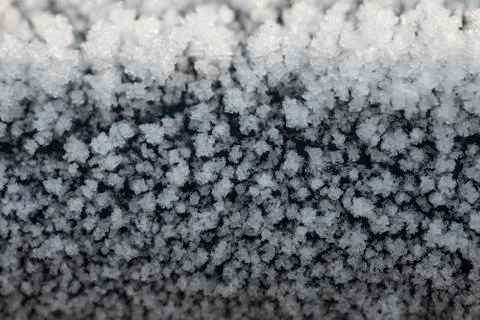 Crystals of frost on a cast iron surface closeup Stock Photos
