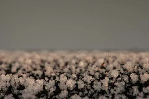 Crystals of frost on a cast iron surface closeup Stock Photos