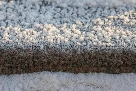 Crystals of frost on the surface granite stone Stock Photos