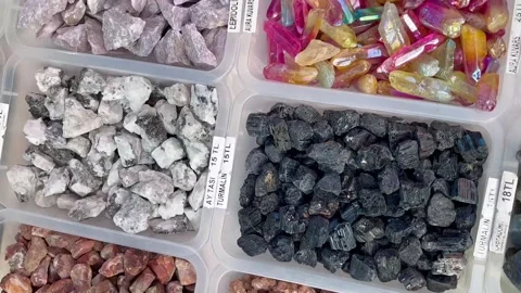 Crystals of stones lie on the table. Stock Footage 240390131