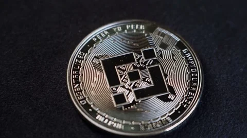 Crytocurrency Exchange BINANCE  BNB  coin close up Stock Footage 211856954