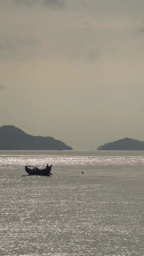 CS - Vertical Video of Sunset and Boat on the Sea Stock Footage 239938376