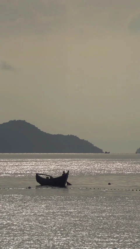 CS - Vertical Video of Sunset and Boat on the Sea Stock Footage 239938565