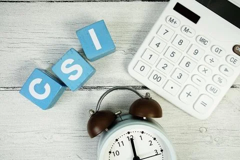 CSI (Customer Satisfaction Index) text with alarm clock and calculator on w.. Stock Photos