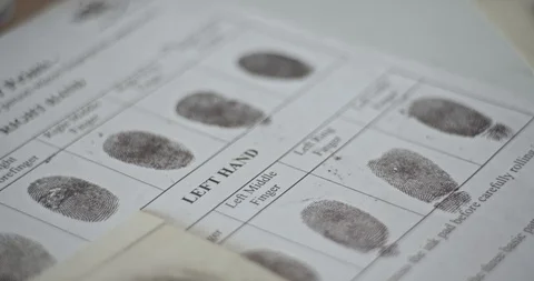 CSI expert compares fingerprints Stock Footage 106460219