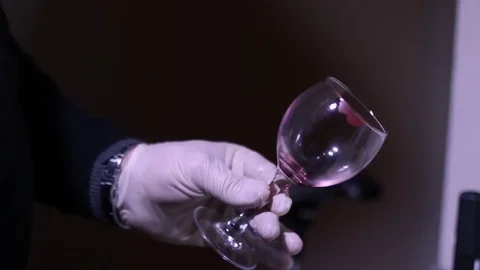 CSI Expert at crime scene exploring wine glass Stock Footage 73258379