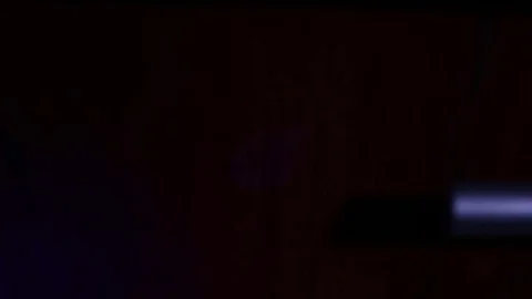 CSI Expert detecting fingerprints with UV lamp Stock Footage 73258600