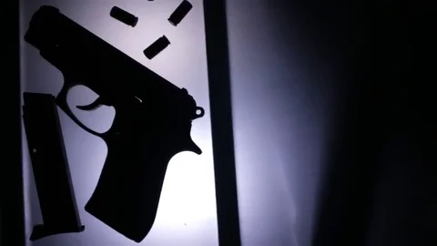 CSI gun on the table Stock Footage 69206857