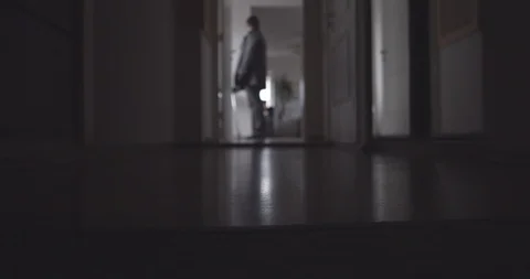 CSI. A man walks through the corridor, killer, assasin. Vídeos de archivo 118546736
