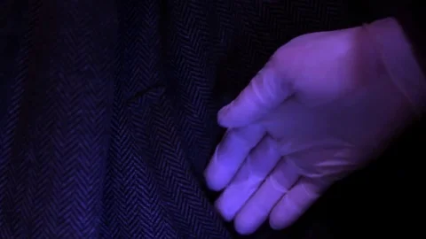 CSI pull out the gun from suspected pocket Stock Footage 73258681