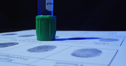 CSI test tubes close up and fingerprint on police fingerprint card Stock Footage 231682569